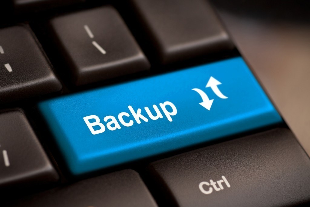 Vibrant blue Backup key on keyboard emphasizes data security and management importance.