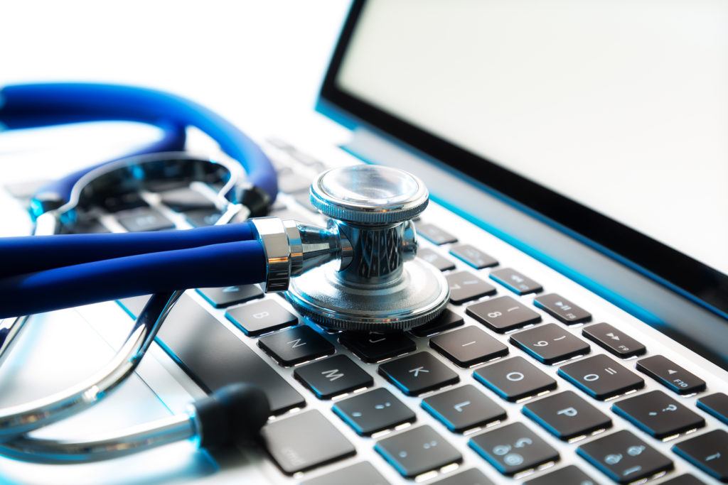 laptop and stethoscope symbolize the fusion of technology and healthcare in modern medicine.