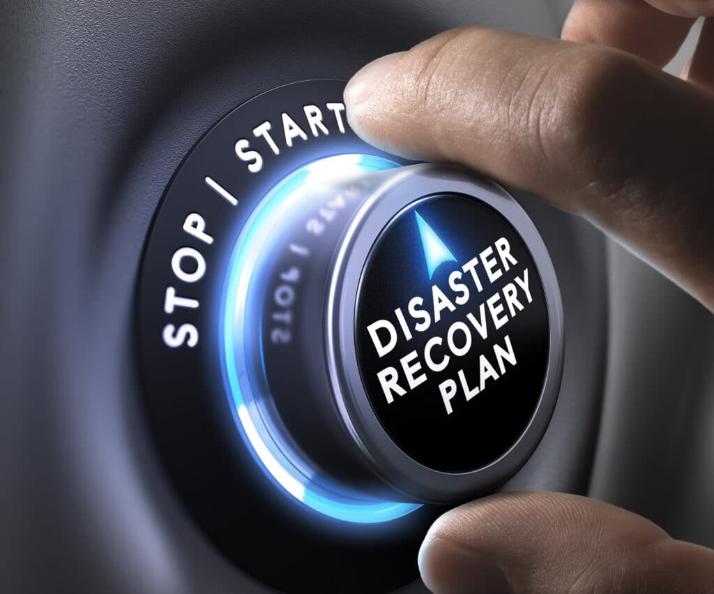 Hand poised to activate the sleek Disaster Recovery Plan control knob, illuminated in calming blue.