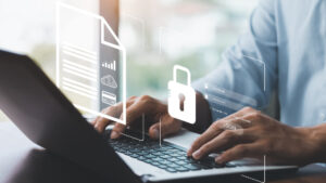 a person using a laptop with a padlock on the screen