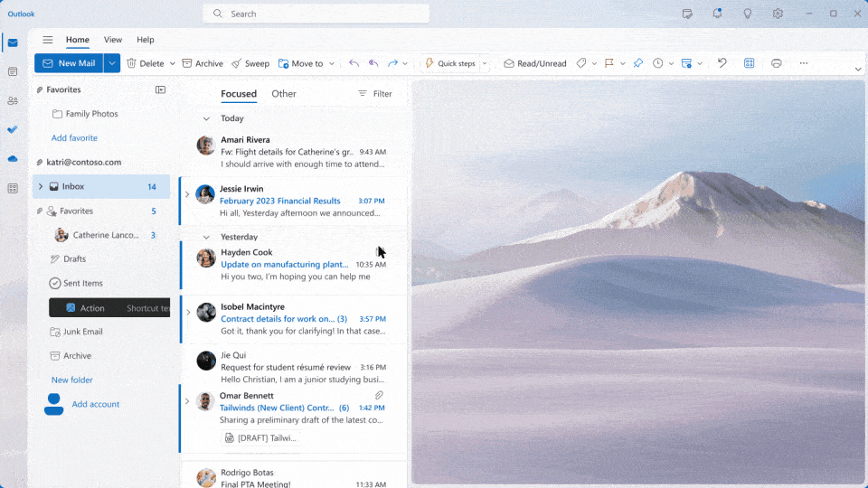 digital workspace interface featuring messaging tools and a calming mountain landscape background.